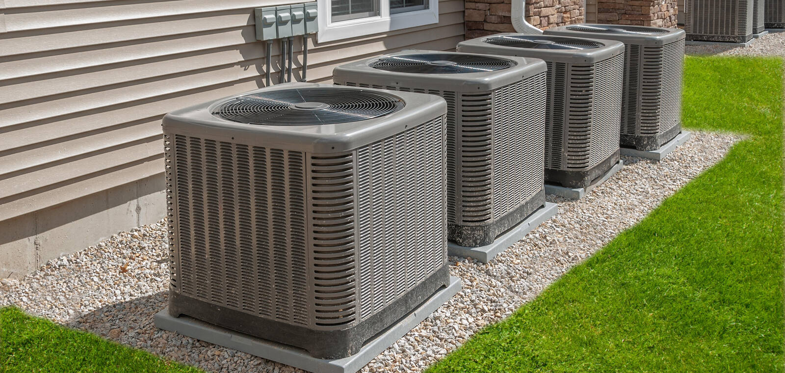 HVAC condenser units installed along the side of a commercial building