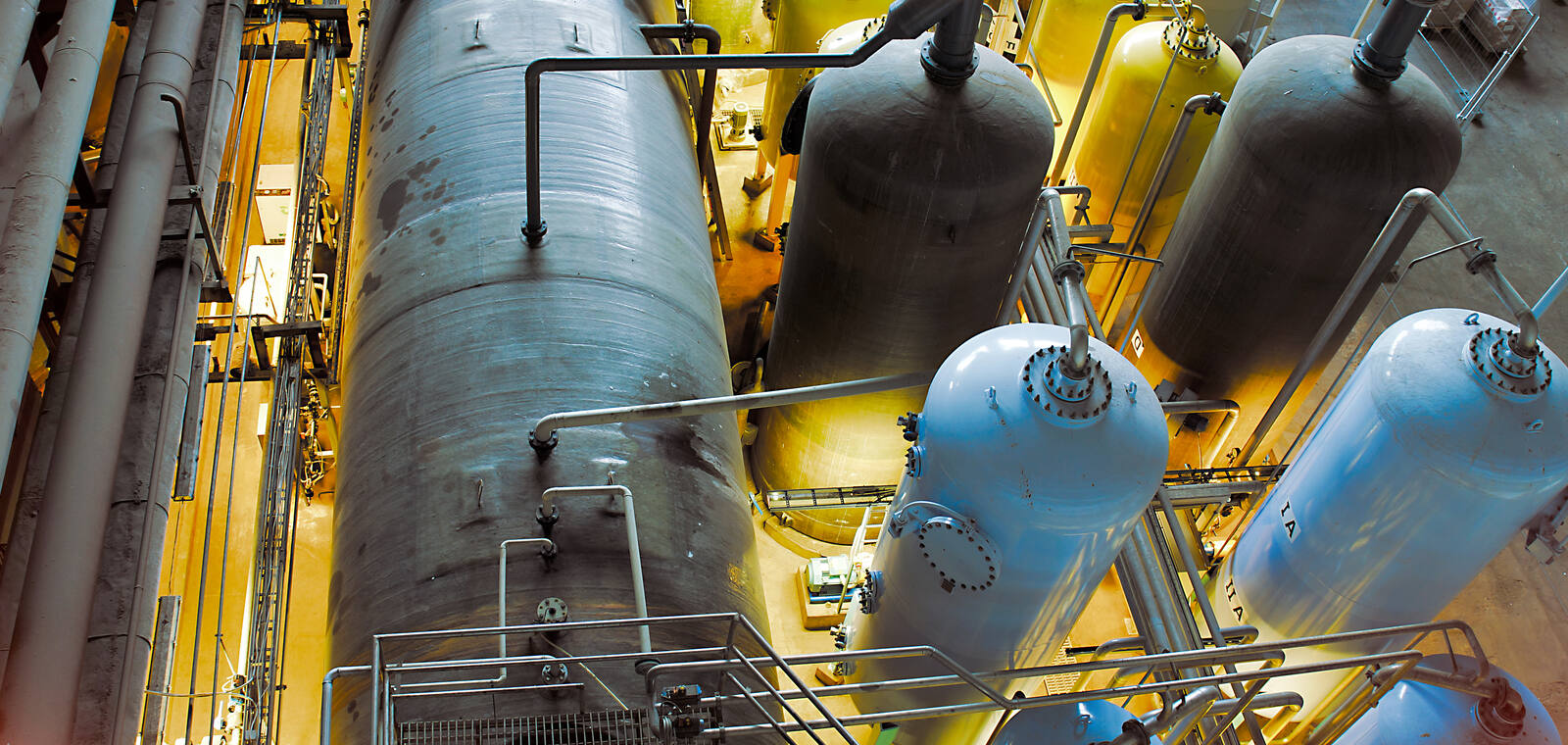 Industrial equipment, cabling and pipework inside a plant