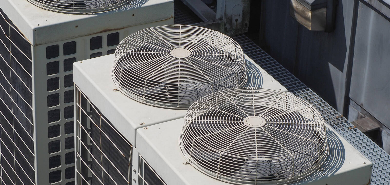Rooftop VRV condenser units installed in a clean array on a commercial building