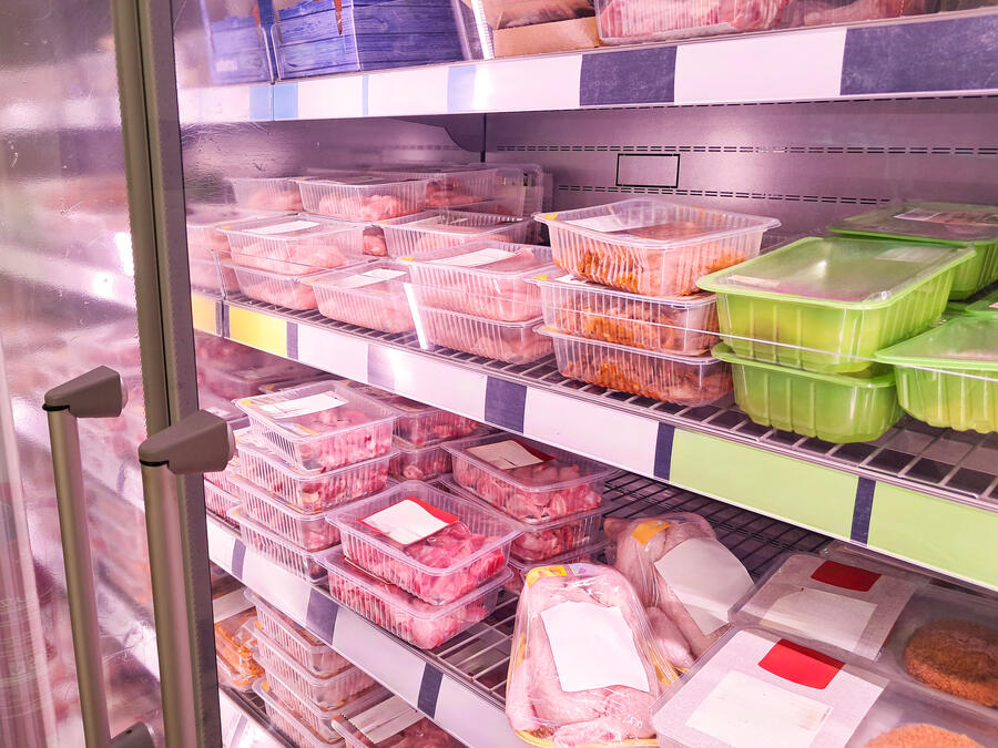 Refrigerated cold-storage room stocked with chilled product on shelving