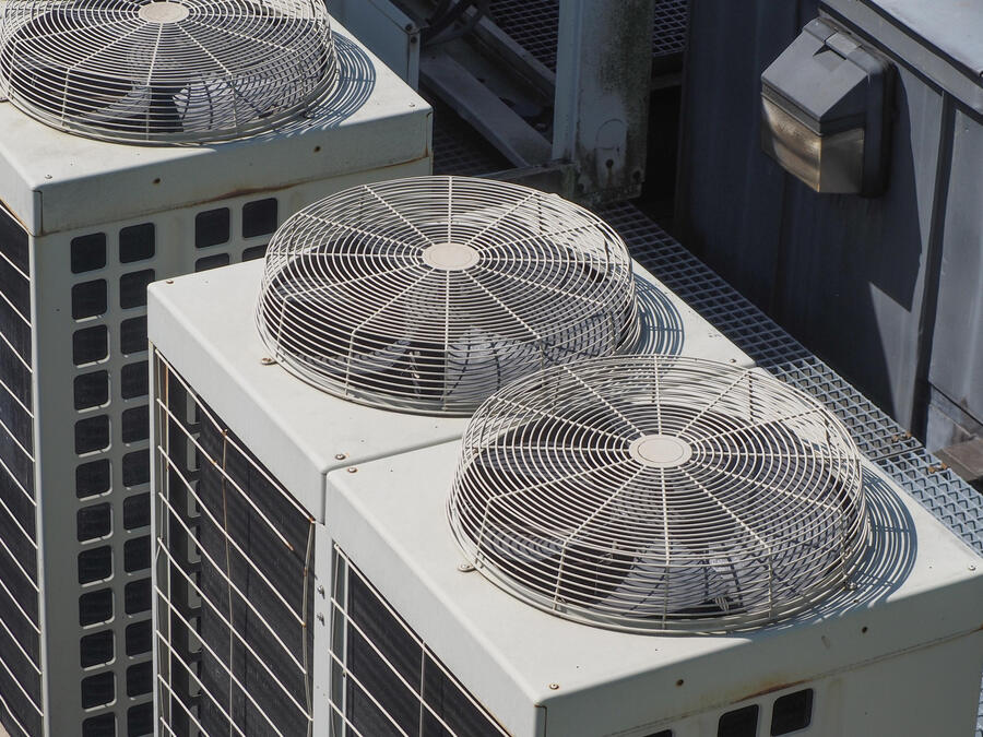 Rooftop VRV condenser units installed in a clean array on a commercial building